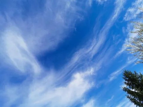 Bright blue sky with clouds, background for design, decoration or wallpaper Stock Photos