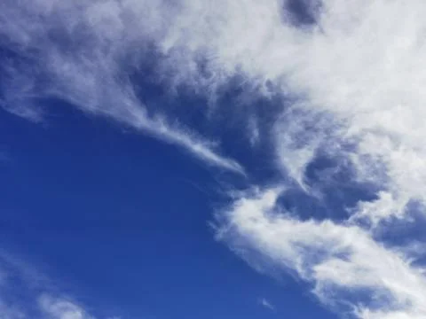 Bright blue sky with clouds, background for design, decoration or wallpaper Foto stock