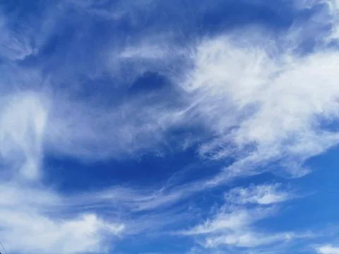 Bright blue sky with clouds, background for design, decoration or wallpaper Stock Photos