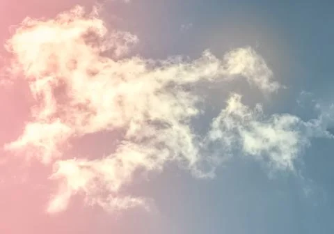 Bright blue sky with clouds with sunset lights, background for design, decora Stock Photos