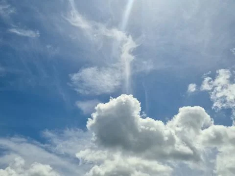 Bright Blue Sky with Dramatic White Clouds Stock Photos