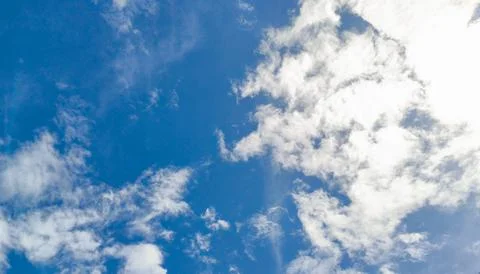 Bright Blue Sky with Dramatic White Cumulus Clouds Stock Photos