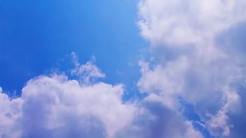 Bright blue sky filled with soft white fluffy clouds (timelaps) Stock Footage 331367179