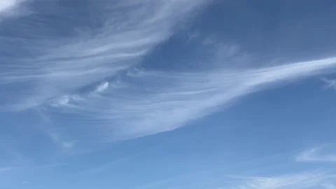 Bright blue sky filled with white cirrus clouds Vídeo Stock 335852892