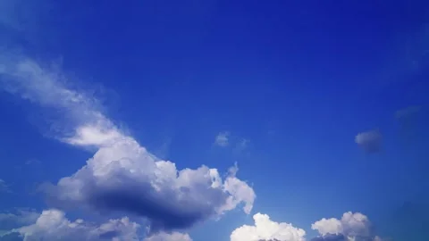 Bright blue sky with fluffy white clouds on a clear sunny day (timelaps) Stock Footage 331367157