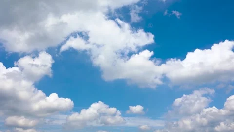 Bright Blue Sky With Fluffy White Clouds Moving Slowly On A Sunny Day Stock Footage 342023232