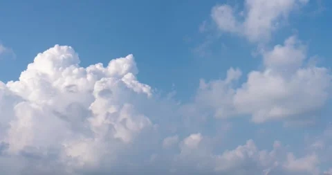 Bright Blue Sky With Fluffy White Clouds Moving Slowly During A Sunny Day Stock Footage 342112340