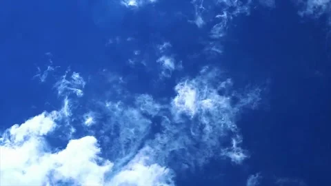 Bright Blue Sky With Fluffy White Clouds Moving Slowly In Sunny Weather Video stock 343515903