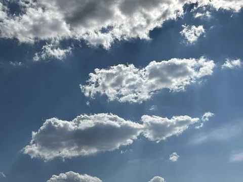 Bright Blue Sky with Fluffy White Cumulus Clouds Stock Photos