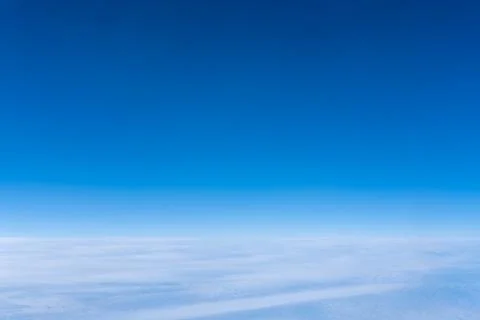 Bright blue sky gradient background. Clear empty sky texture, blank skyscap.. Photos