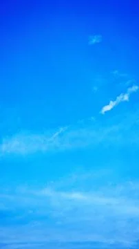 Bright Blue Sky with Light Clouds Stock Photos