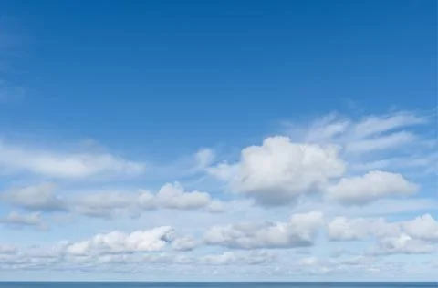 Bright Blue Sky with Multiple Layers of Clouds and Sea Horizon 279 Stock Photos