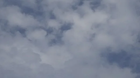 Bright Blue Sky with Puffy White Cumulus Clouds Stock Footage 340380757
