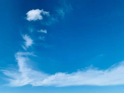 Bright Blue Sky with Soft White Clouds at Tanjung Lesung Beach Stock Photos