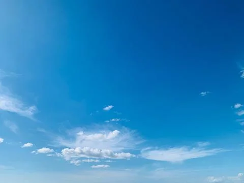 Bright Blue Sky with Soft White Clouds at Tanjung Lesung Beach Stock Photos