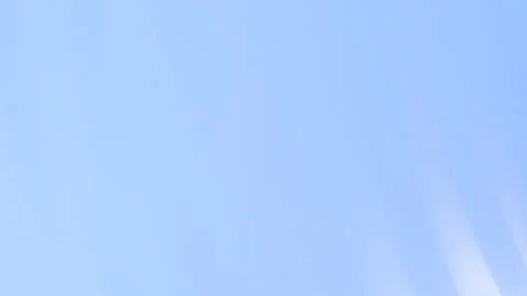 Bright Blue Sky with Subtle Sunbeams and Ethereal Light Streaks Vidéo 329253678