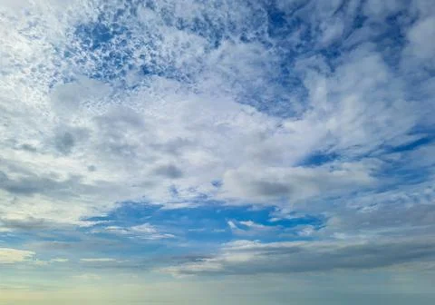 Bright blue sky with white cloud patches at morning 스톡 사진