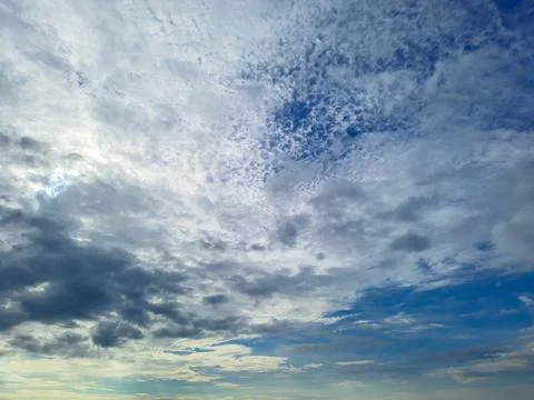 Bright blue sky with white cloud patches at morning Stock-Fotos