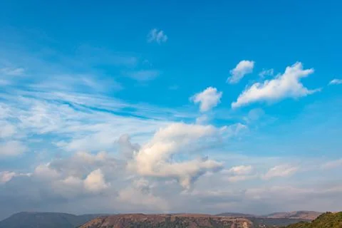 Bright blue sky with white cloud over mountain at morning from flat angle 스톡 사진