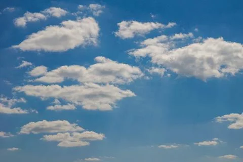 Bright blue sky with white clouds. Summer sunny day Stock Photos