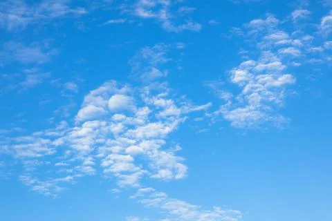 Bright Blue Sky with White Clouds Stock Photos