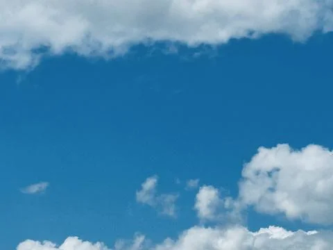 Bright Blue Sky With White Clouds Natural Background. Stock Photos