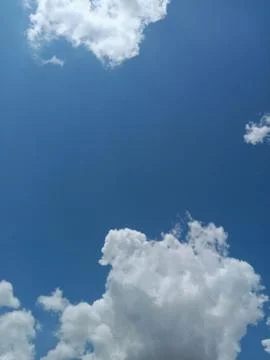 Bright blue sky with white clouds, Puffy cumulus clouds in clear sky, Cloudsc 스톡 사진