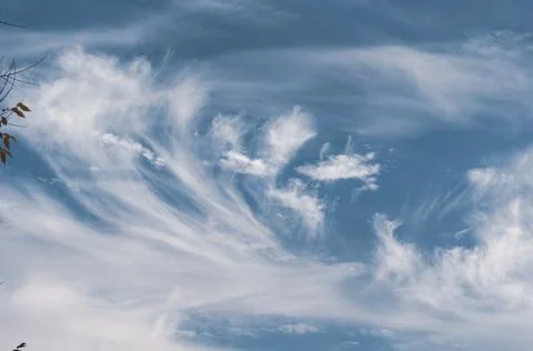 Bright blue sky, white translucent feathery clouds, swirls strong gust, Outdo Stock Photos