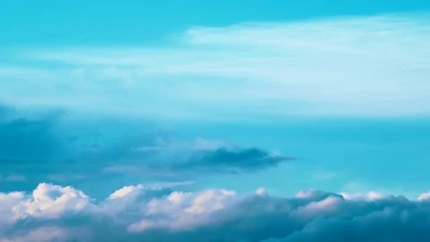 The bright blue summer sky with quickly floating clouds. Stock Footage 70565733
