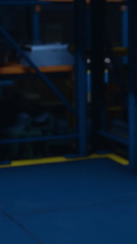 Bright blue warehouse with yellow markings in late afternoon light Stock Footage 334244595