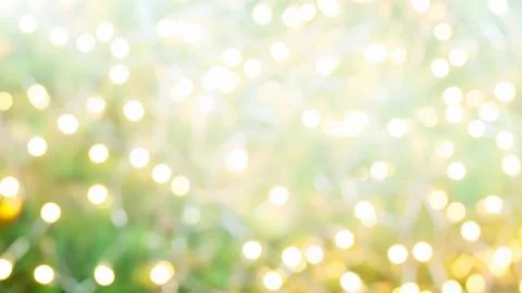 Bright blurred christmas tree with string lights abstract background Stock Photos