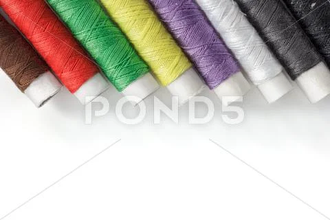 Bright bobbin thread isolated on white Stock Photos