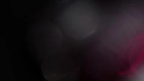 Bright bokeh in the background with a large light leak on the right Vídeo Stock 319394110