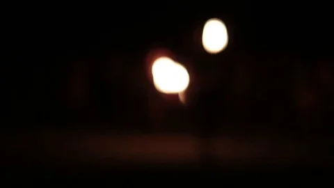 Bright bokeh from fire show dancers. Video stock 77232192