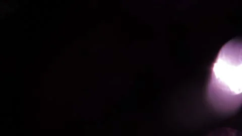 The bright bokeh light on the right stands out in the darkness. Stock-Footage 318943548