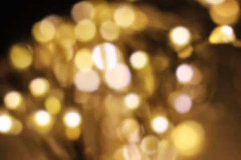 Bright bokeh lights on a dark background, blur Stock Photos