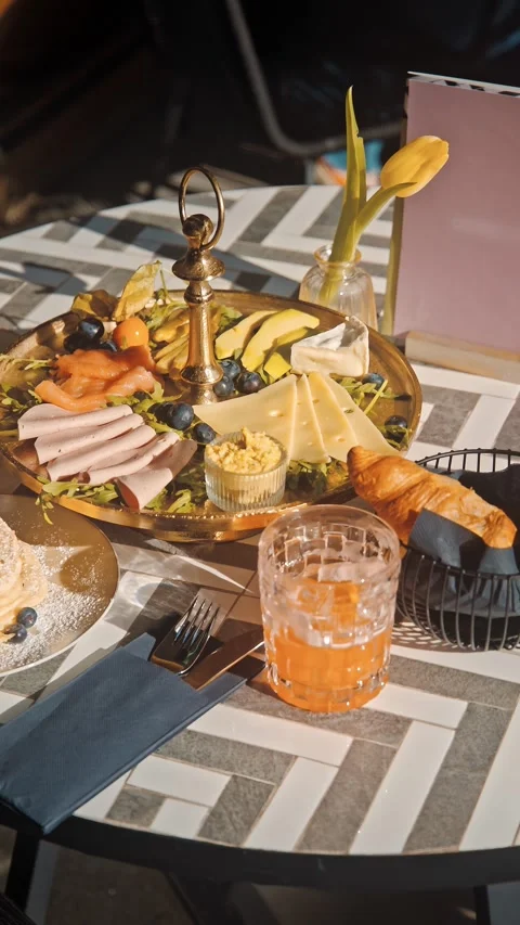 Bright Breakfast Spread with Fruits, Drinks and Dishes Stock Footage 334604486
