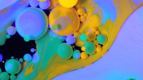 Bright bubbles of paint in water Stock Footage 88414521