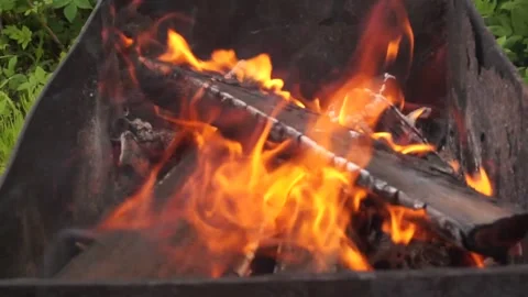 Bright burning fire in the grill. cooking in nature. making a fire. Stock Footage 130595769
