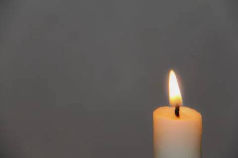 A bright candle in the dark Stock Photos