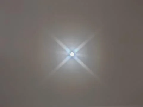 Bright Ceiling LED Light With Symmetrical Starburst Effects Stock Photos