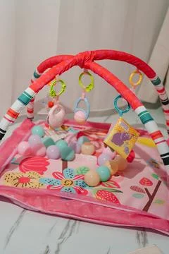 A bright children's developmental mat with arches Stock Photos