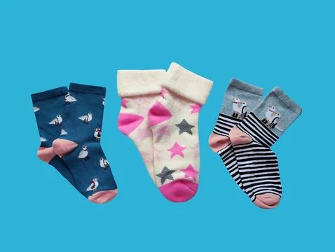 Bright children's multi-colored socks with decorative pattern, top view Stock Photos