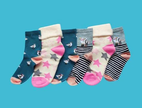 Bright children's multi-colored socks with decorative pattern, top view Stock Photos