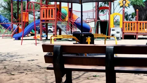 Bright Children’s Playground With Bench – 4K Pan Shot Stock Footage 320738575