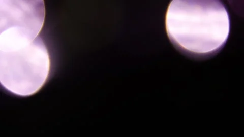 A bright circle of flashing light in the background. 스톡 동영상 309756329