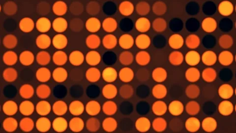 Bright circles create pattern on dark background in motion Stock Footage 338232837