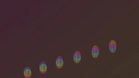 Bright circles of light create a wavy pattern on a dark Stock Footage 339585918