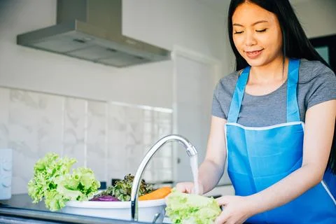 Bright clean vegetables being washed Stock Photos