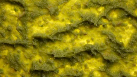 Bright closeup top view of avocado smash rotating in 4K 스톡 동영상 86098140